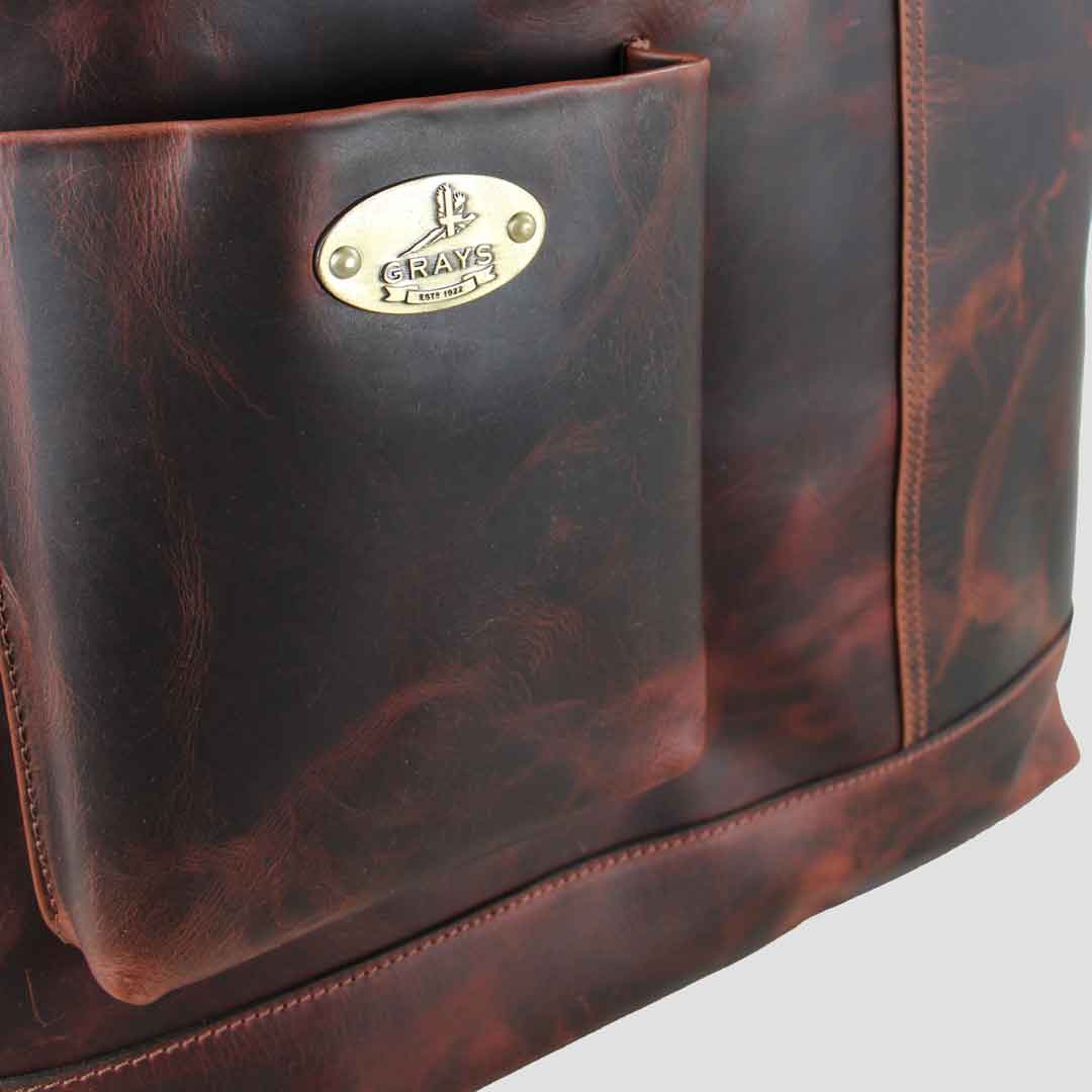 fitted with a grays 1922 embossed brass plaque to the open front pocket