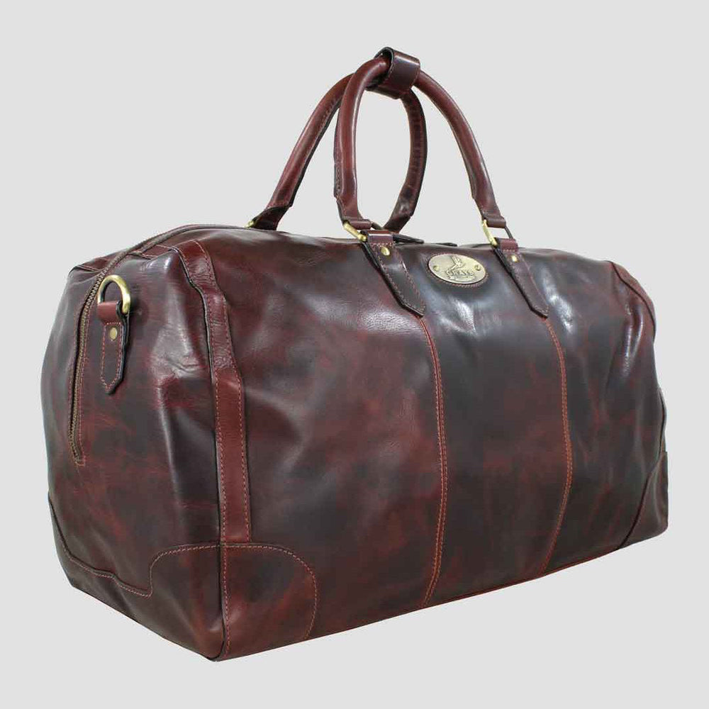 Brown leather duffel bag on a light gray background