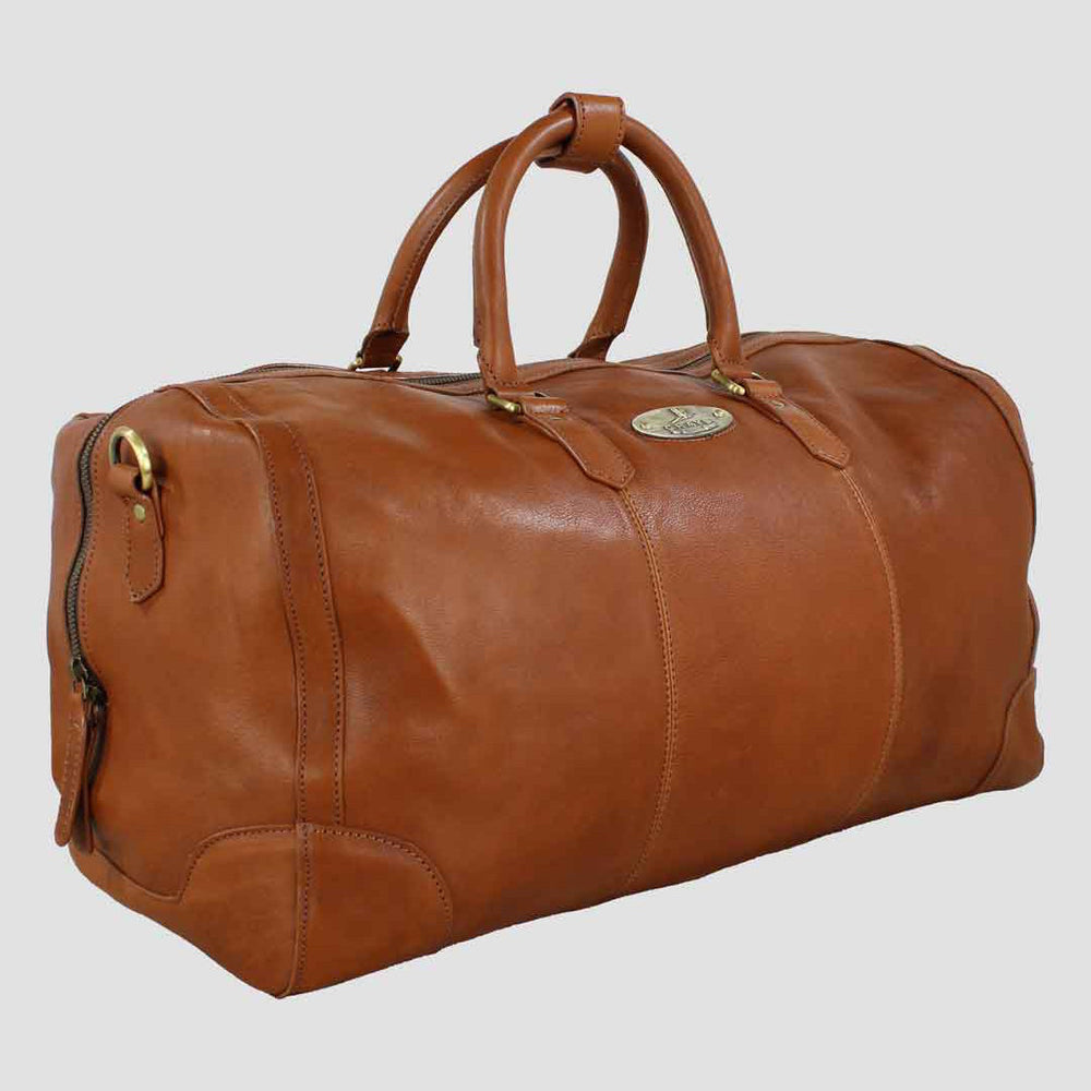 Brown leather duffel bag on a light gray background