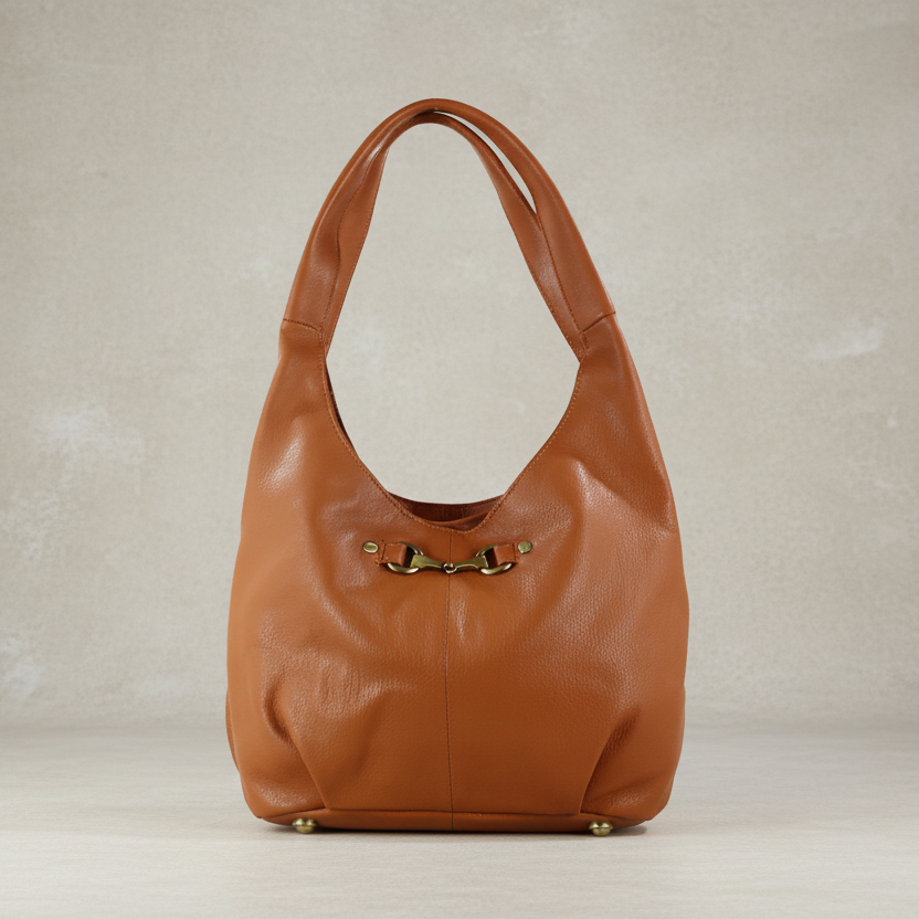 Brown leather handbag on a neutral background