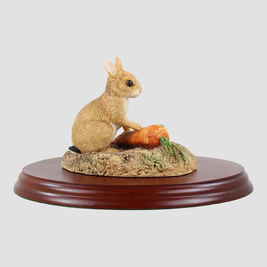 Rabbit With Carrots on Plinth Border Fine Arts