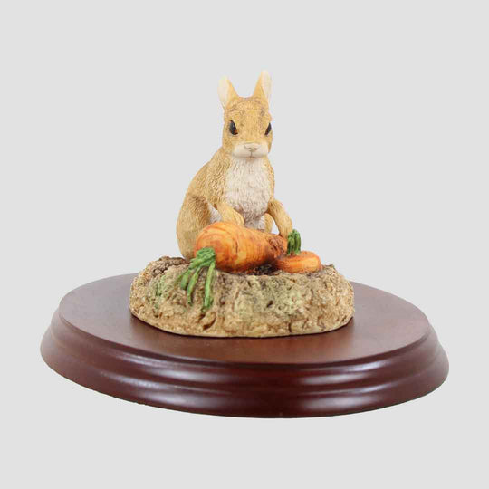 Rabbit With Carrots on Plinth Border Fine Arts