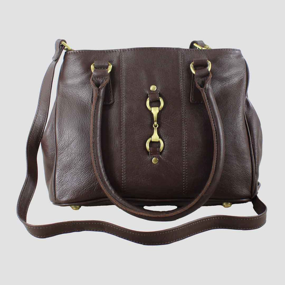 Brown leather handbag with gold hardware on a light gray background