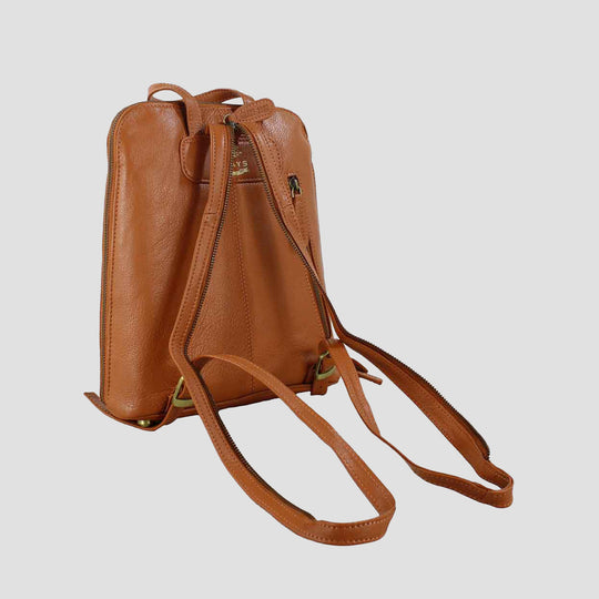 Brown leather backpack on a light gray background