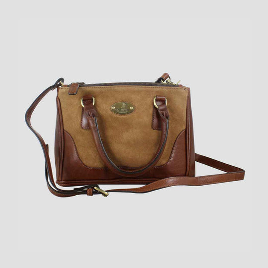 Brown leather handbag with a visible brand logo on a light gray background